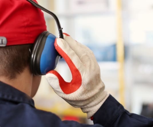 A Worker wearing Protecting Hearing Equipment